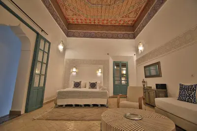 a bedroom with a bed and a coffered ceiling at Riad 5 GÉNÉRATIONS in Marrakech
