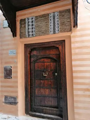 a door on the side of a building at Riad Aventurine in Marrakech