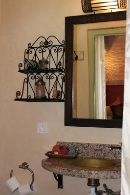 a bathroom with a sink and a mirror at Riad la medersa in Marrakech