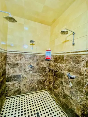 a bathroom with a shower with a sink at Riad Dar Essassi 23 in Marrakech