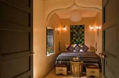 a bedroom with a bed in a room at Riad Papillon by Marrakech Riad in Marrakech