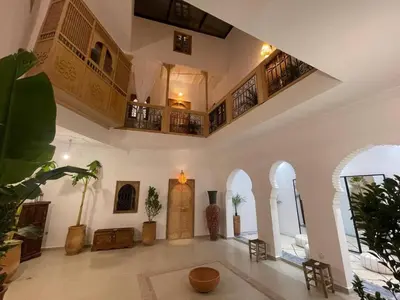 a large living room with a lot of plants in it at RIAD ZEFYR in Marrakech