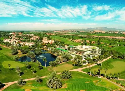 an aerial view of a golf course with a resort at Palmeraie Golf Suites By Pickalbatros in Marrakech