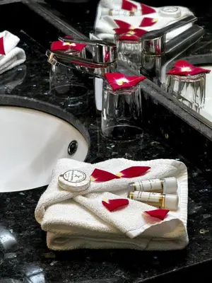 a bathroom counter with a sink with a towel at Stars Hotel & Spa in Marrakech