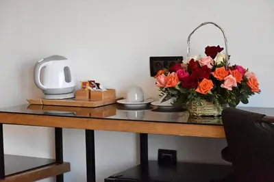 a table with a vase of flowers on it at Stars Hotel & Spa in Marrakech