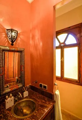 a bathroom with a sink and a mirror at Casa De Marrakech Riad Guest House in Marrakech