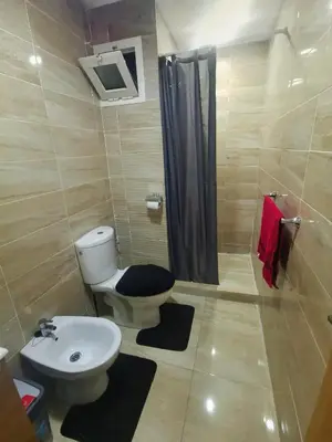 a bathroom with a toilet and a sink at La saphir marrakech in Marrakech