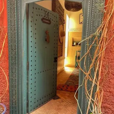 a large door in a room with a hallway at Dar 14 Marrakech in Marrakech