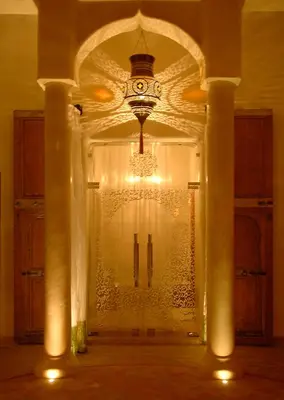 a room with a glass door with a chandelier at MAISON MK Adults ONLY - Music Riad in Marrakech