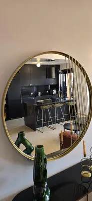 a mirror on a table in a living room at Luxueux appartement entre Gueliz et l'Hivernage avec WIFI in Marrakech