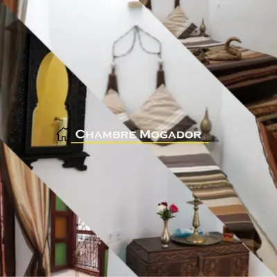 a stairway in a room with a table at Riad Ahlsouss in Marrakech