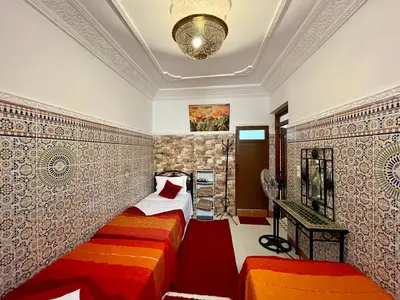 a bedroom with two beds in a room at Cosy appartement in Marrakech