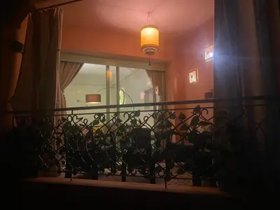 a balcony with a window and a pendant light at Appartment Rhizlane in Marrakech