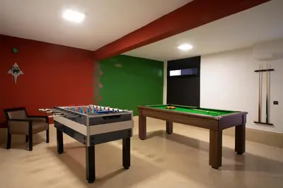 a room with two pool tables at Villa Tilila in Marrakech