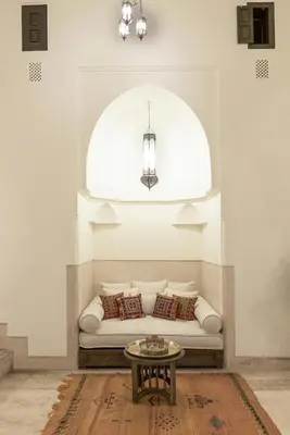 a living room with a couch and a table at Riad Hayati in Marrakech