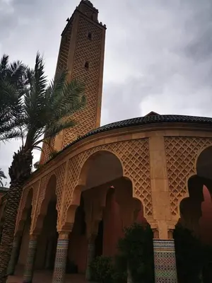 a building with a clock tower on top of it at Riad NEJJARINE in Marrakech