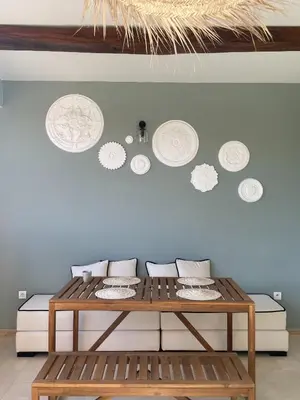 a table in a room with plates on a wall at Chimera Apartments & Suites in Marrakech