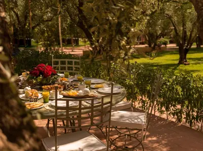 a table with plates of food and flowers on it at CASA ABRACADABRA in Marrakech