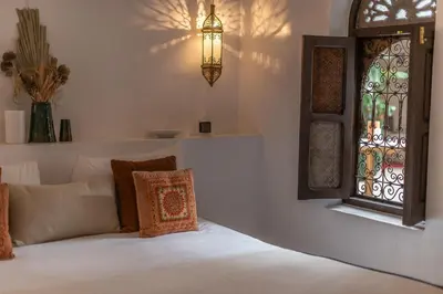 a bedroom with a bed and a window at Riad Babouchta & Spa in Marrakech