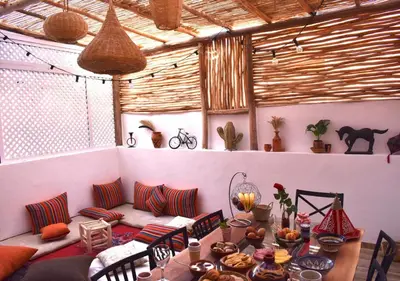 a room with a couch and a table in a room at COSY LUXURY Apartment - GUELIZ in Marrakech