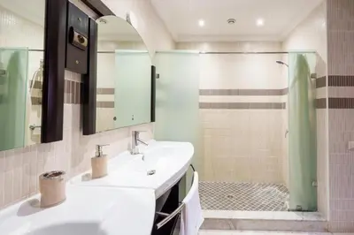 a bathroom with a sink and a shower at Villa avec piscine - Petit déjeuner Gratuit - Marrakech City Center in Marrakech