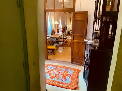a view of a living room with a dining room at DAR CHIBANIA in Marrakech