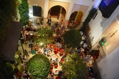 an overhead view of a crowd of people in a building at DAR CHIBANIA in Marrakech