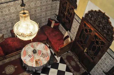 an overhead view of a living room with a table and chairs at Riad Fattouma Kasba in Marrakech