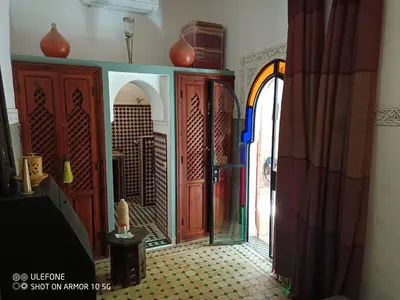 a room with a door with a view of a city at Riad Zagouda in Marrakech
