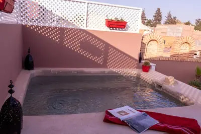 a small pool of water in a backyard at RIAD KERDOUSS in Marrakech