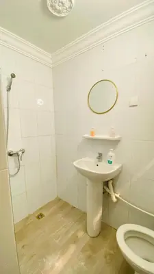 a bathroom with a sink and a toilet at house miss rose in Marrakech