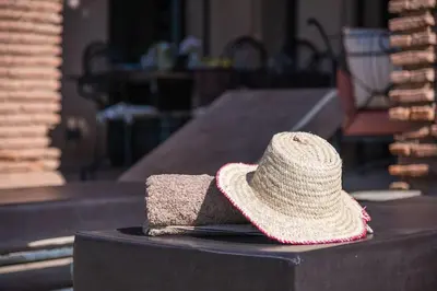 a straw hat sitting on top of a table at Villa Selma avec piscine chauffée in Marrakech