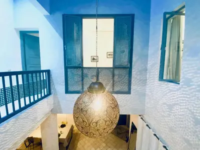 a large chandelier hanging from the ceiling in a room at AZ RIAD in Marrakech