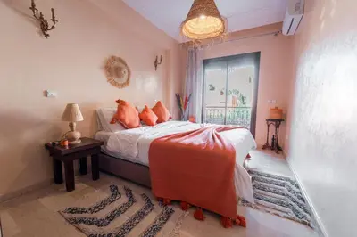 a bedroom with a bed and a window at Majorelle Garden Retreat 2BR Apartment Near Jardin Majorelle in Marrakech