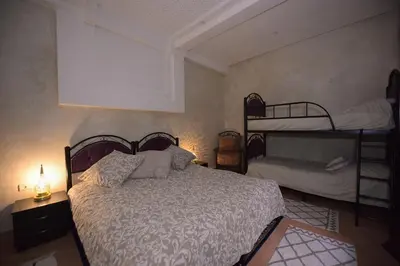 a bedroom with a bed and two bunk beds at 