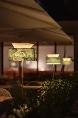 two lights in a room with some plants at Hotel Jadali & Spa in Marrakech