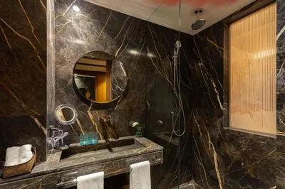 a bathroom with a sink and a mirror at Hotel Jadali & Spa in Marrakech