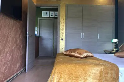 a bedroom with a bed with a pillow on it at Cosy Loft Emeraude Marrakech Prestigia Golf City in Marrakech
