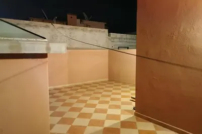 an empty room with a checkered floor at 90 qm Wohnung mit 2 Schlafzimmern in Marrakech