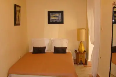 a bedroom with a bed with two pillows at Emplacement N°1 ! RIAD ICA (EN EXCLUSIVITE) in Marrakech