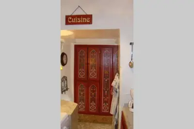 a bathroom with red doors and a sign that reads cuisine at Emplacement N°1 ! RIAD ICA (EN EXCLUSIVITE) in Marrakech