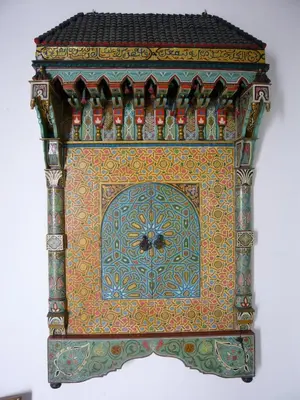 a box with a bee on the top of it at Riad Timila in Marrakech