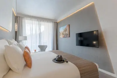 a hotel room with a bed with a hat on it at Pestana CR7 Marrakech in Marrakech