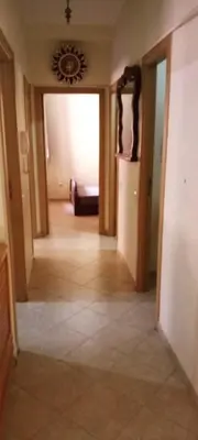 a hallway of a house with a room with a couch at Twins 13 in Marrakech