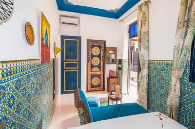 a room with blue and white tiles on the walls at Riad Nouceiba Marrakech in Marrakech