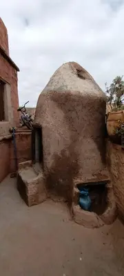 a brick oven with a blue object inside of it at Riad Amegrad in Marrakech