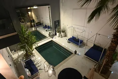 an overhead view of a swimming pool in a house at Riad 5 Chambres & Piscine & Breakfast - Marrakech in Marrakech