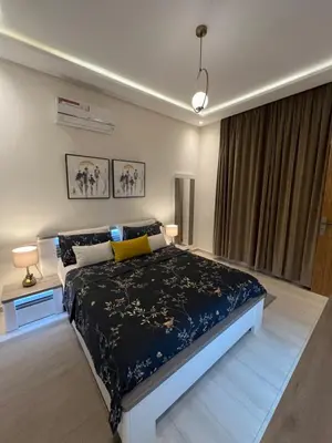 a bedroom with a large bed and a window at Dar Sanaa Marrakech in Marrakech