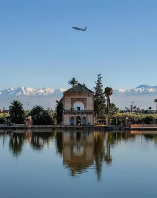 a building sitting on top of a large lake at Dar Anass Marrakech in Marrakech