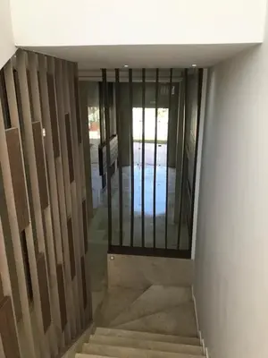 a view of a hallway with a door and stairs at SUNNY 48- Appart Cozy -Marrakech-centre in Marrakech